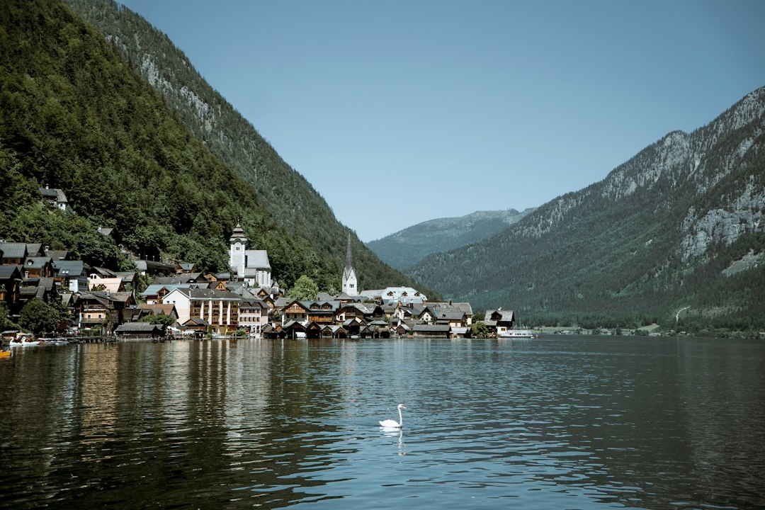 Hallstatt vs Gmunden, Lake Bled vs Lake Bohinj, and Neuschwanstein vs Hohenzollern: Comparing Lower-Impact Family Photography Alternatives by October Crowds, Train Emissions, Walking Distance, Stroller Access, and Daily Cost