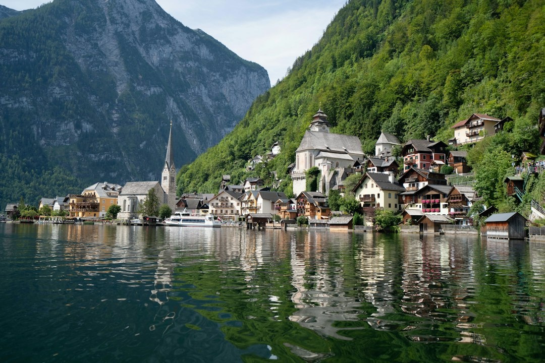 Hallstatt vs Gmunden, Lake Bled vs Lake Bohinj, and Neuschwanstein vs Hohenzollern: Comparing Lower-Impact Family Photography Alternatives by October Crowds, Train Emissions, Walking Distance, Stroller Access, and Daily Cost