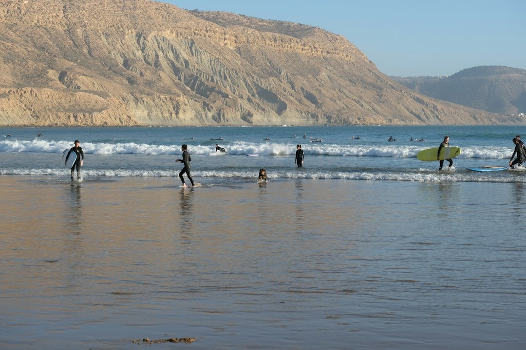 How to Learn to Surf in Taghazout, Morocco in October on a Backpacker Budget: A Step-by-Step Two-Week Plan With Surf-Camp vs Standalone Lesson Prices (€15–€35), Board Rental, Beginner Breaks From Devil's Rock to Panorama, Agadir Airport Transfers, Hostel Dorms From €8, and a Total Under €550